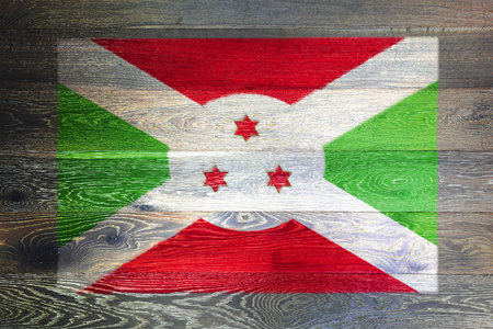 Burundi flag on rustic old woodの写真素材