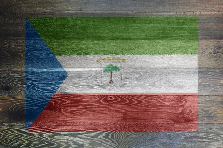 Equatorial guinea flag on rustic old wood surface backgroundの写真素材