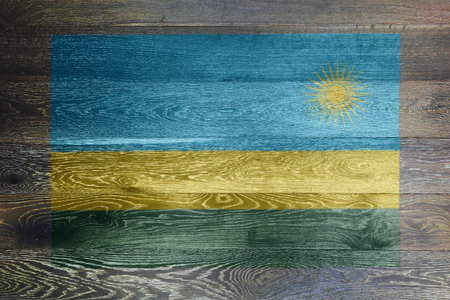 Rwanda flag on rustic old wood surface backgroundの写真素材