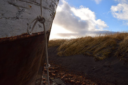 Old fishing boat on the beach at Rif in Iceland.の写真素材