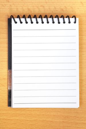 blank page from a notebook of a brown deskの写真素材