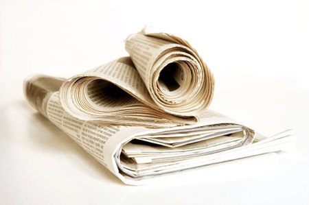 pile of old newspaper on a white background