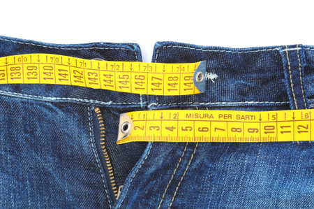 diet concept, jeans with measure tape, isolated on white background