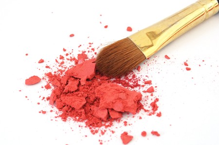 makeup brush and cosmetic powder isolated on white backgroundの写真素材