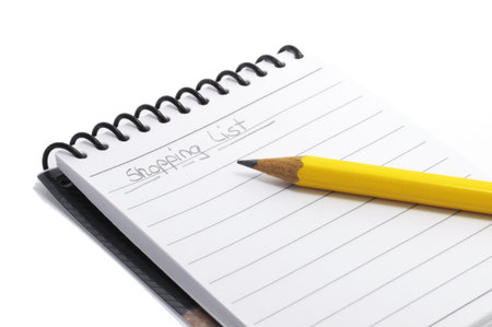 Pen on the handwritting shopping list. isolated on white background.
