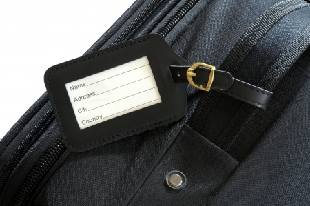 black leather label on a black suitcase の写真素材