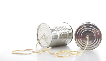 closeup of a tin cans phone isolated on white background, communication conceptの写真素材