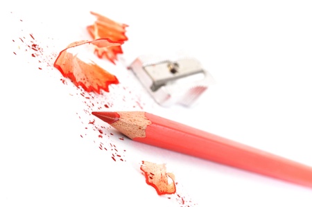 red pencil with shavings isolated on with backgroundの写真素材