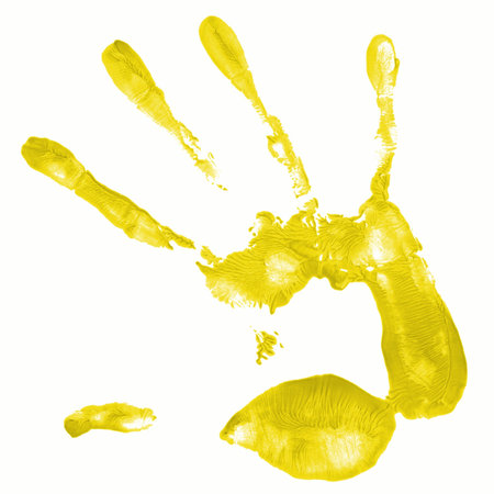 a hand print with yellow color istolated on white backgroundの写真素材