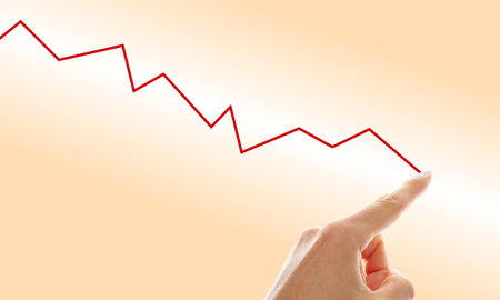 hand tracing a falling graph symbol for a shrinking business