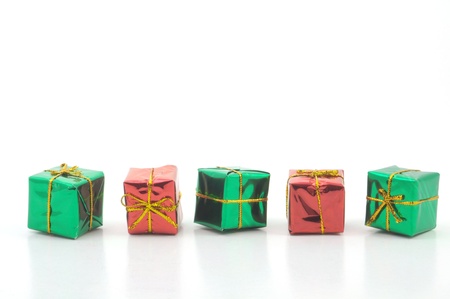 pile of green and red christmas pesents isolated on white bacgroundの写真素材