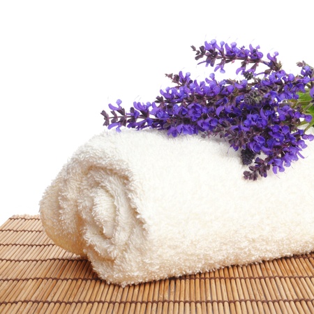 a bunch of lavender on a white towel against white backgroundの写真素材