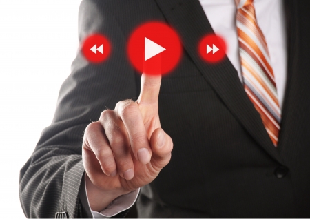 a business hand press play button on touch screen の写真素材