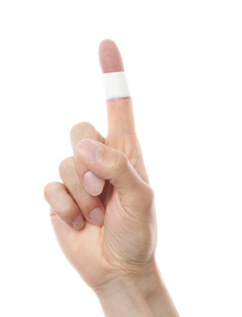 band aid plaster applied to a fingerの写真素材