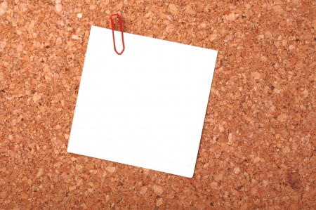 reminder notes with a paperclip on a noticeboardの写真素材