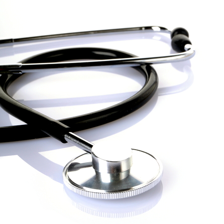 a black stethoscope isolated on white backgroundの写真素材