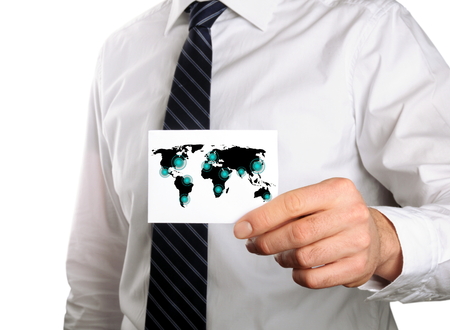 businessman holding a business card with his travel route to his cooperation partnersの写真素材