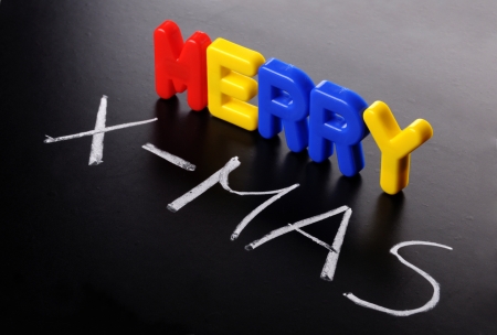 colored letters and chalk give the words merry x-masの写真素材