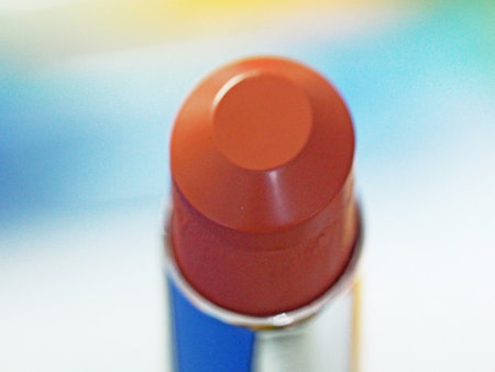 Closeup macro view of orange-brown bullet lipstickの写真素材