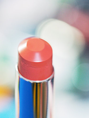 Closeup macro view of orange-brown bullet lipstickの写真素材
