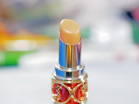 Closeup macro view of orange lip balmの写真素材