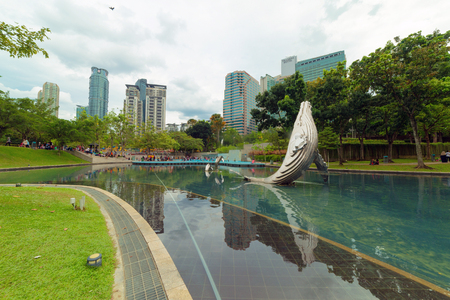 Lake park of downtown kuala lumper with cloud skyの写真素材