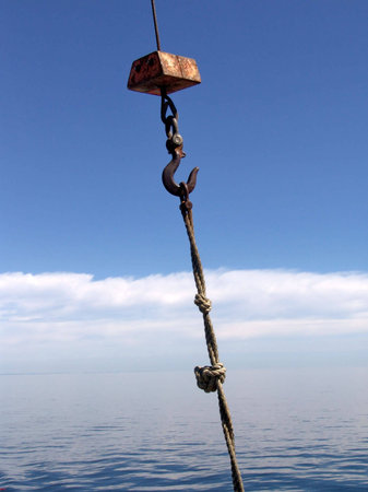 Hook connected to support on blue sky backgroundの写真素材