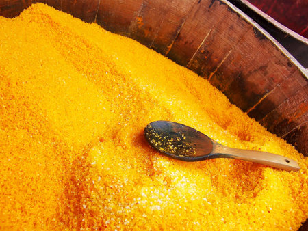 Wood barrel filled with yellow bath salt.の写真素材