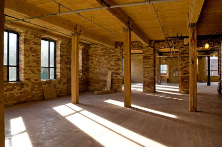 Old brick building is under reconstruction for modern office spaces. Old brick building is under reconstruction for modern office spaces.