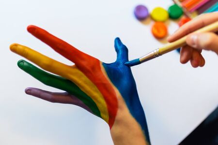 Stock photo of a caucasian person water painting on their hands.の写真素材