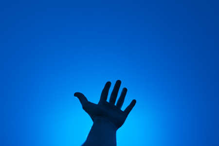 Face of anonymous person against blue sky.の写真素材