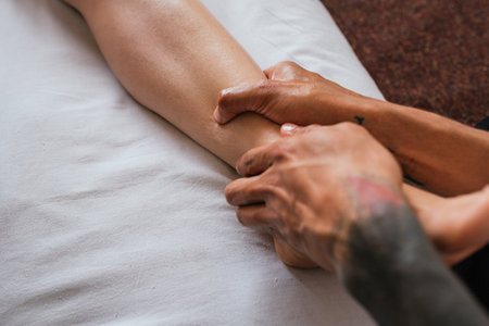 Stock photo of unrecognized person enjoying leg massage in spa.の写真素材