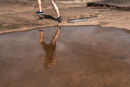Unrecognized man running in the street and wearing sports clothes.の写真素材