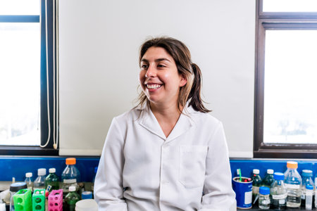 Close up portrait of female scientist smiling in the laboratory.の写真素材
