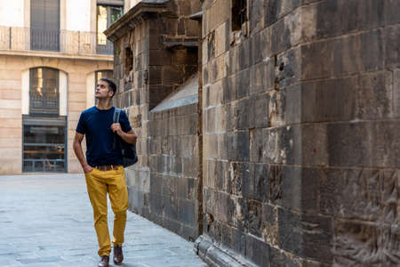Young latin tourist man visiting the city.の写真素材
