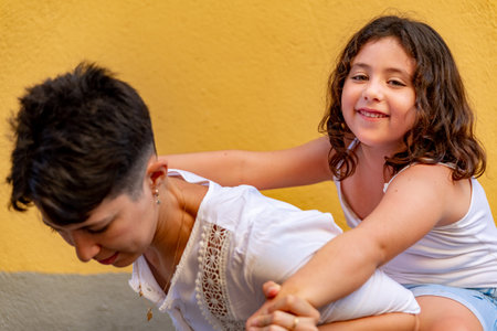 Mother and daughter enjoying summer outside together.の写真素材