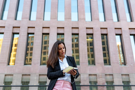 Caucasian business woman with notebook in the city