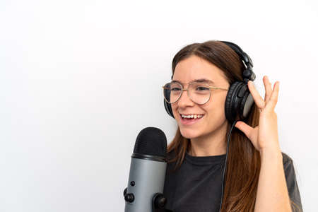 Young latin female announcer against white backgroundの写真素材