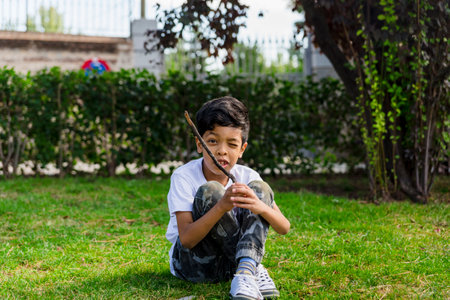 Young boy alone. having fun in a park.の写真素材