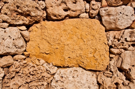 Background of textured stone wallの写真素材