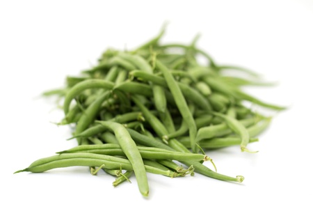 heap of green beans isolated on white backgroundの写真素材