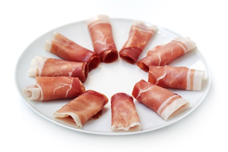 plate of ham rolls on white backgroundの写真素材