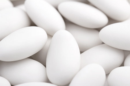 close up of a group of white sugared almonds