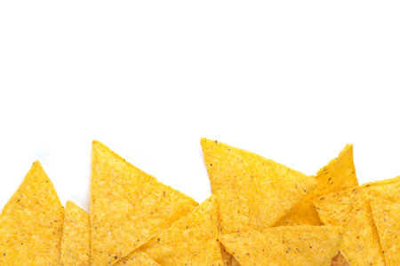 edge of tortilla chips on white background