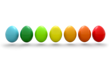 multicolored easter eggs in row on white backgroundの写真素材