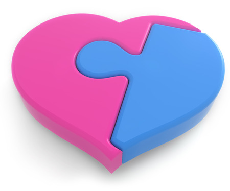 pink and blue jigsaw pieces connected in heart shapeの写真素材