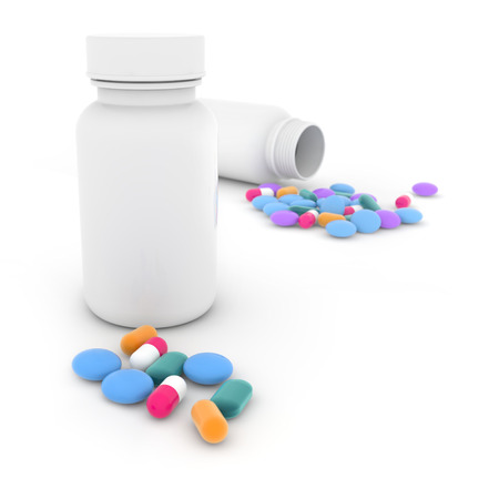two plastic bottles and mixed pills on white backgroundの写真素材