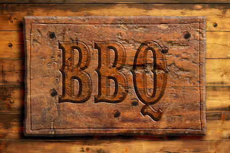 bbq panel on an old wooden wallの写真素材
