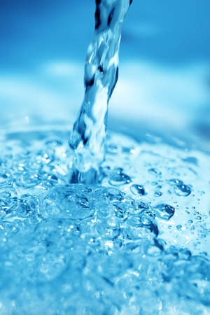 close up of blue water jet and bubblesの写真素材