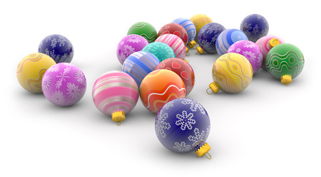 heap of colorful christmas baubles on white backgroundの写真素材